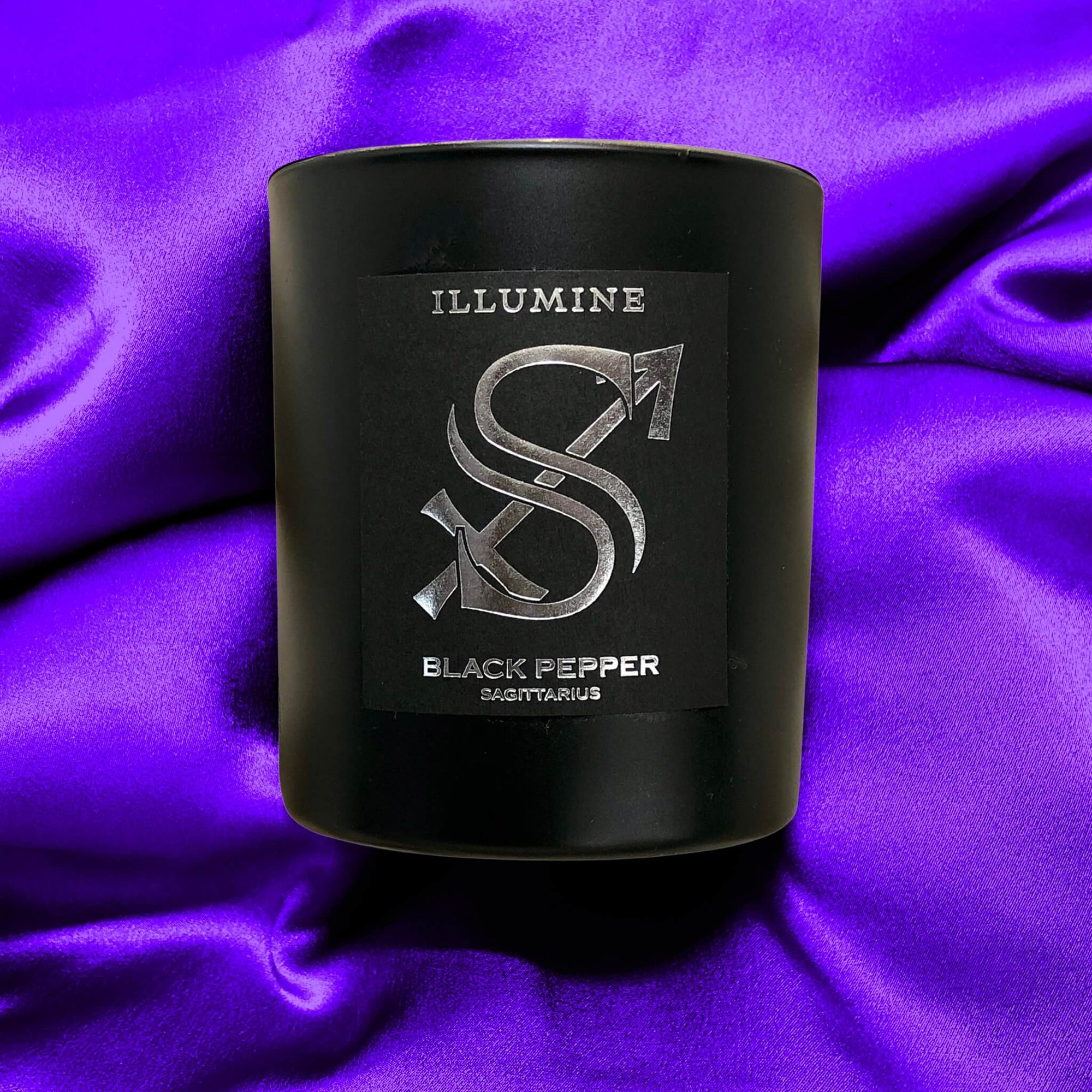 Illumine Sagittarius Candle on Purple for innovative